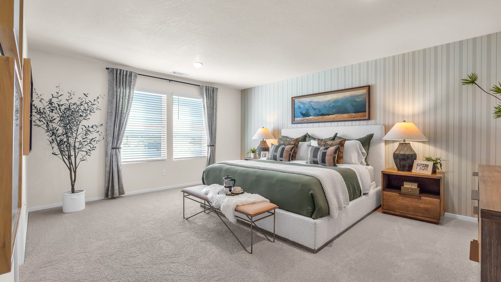 Primary bedroom with wall-to-wall carpet, a walk-in closet and an attached bathroom