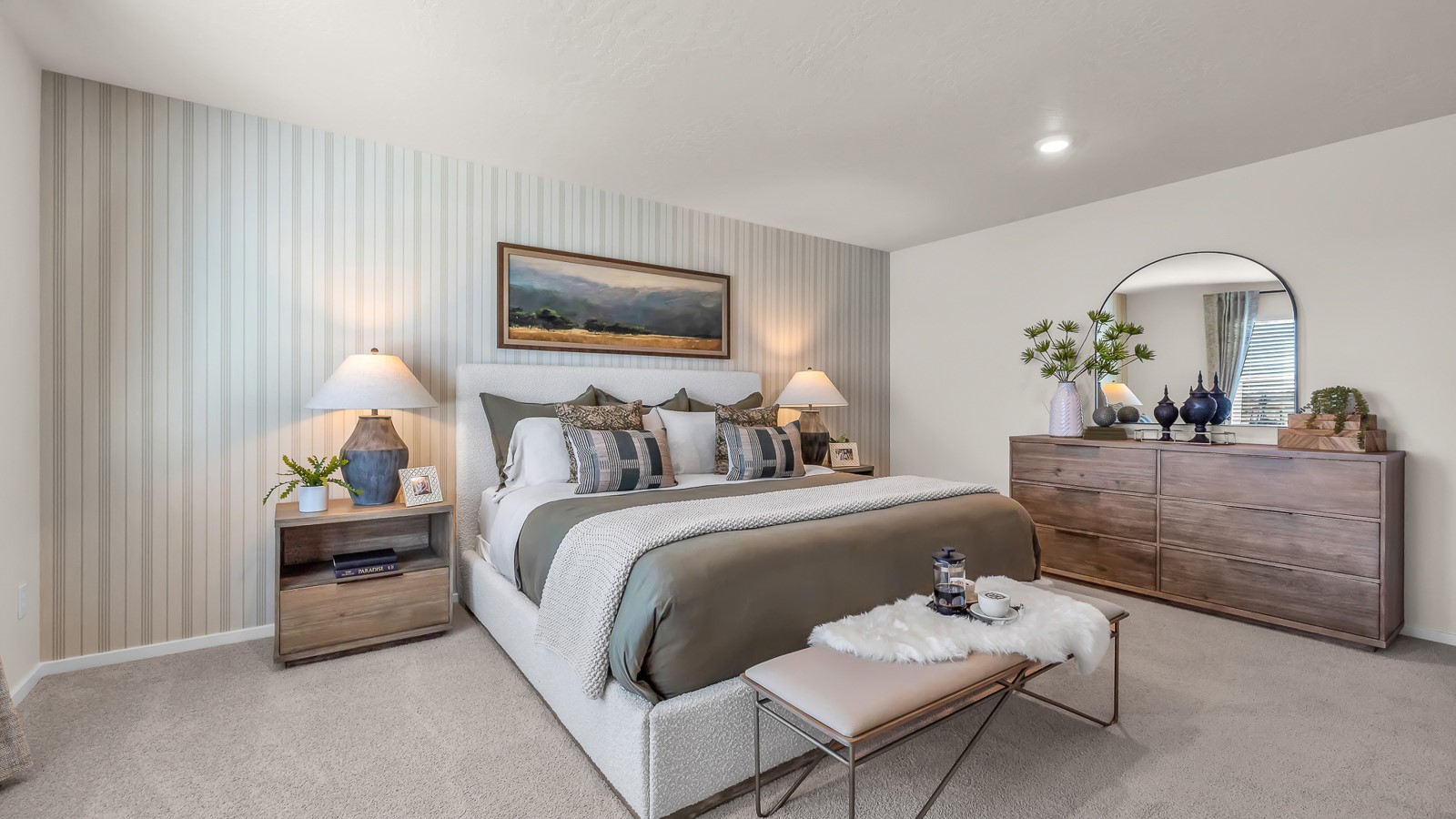 Primary bedroom with wall-to-wall carpet, a walk-in closet and an attached bathroom