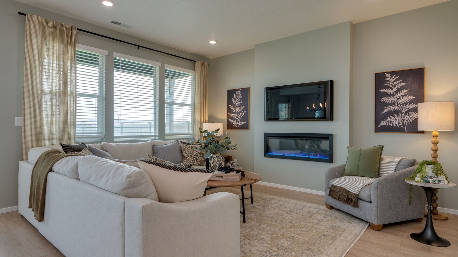 Great room with laminate flooring and an electric fireplace