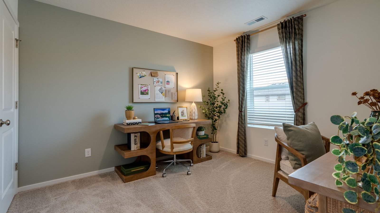 Bedroom with wall-to-wall carpet and a closet