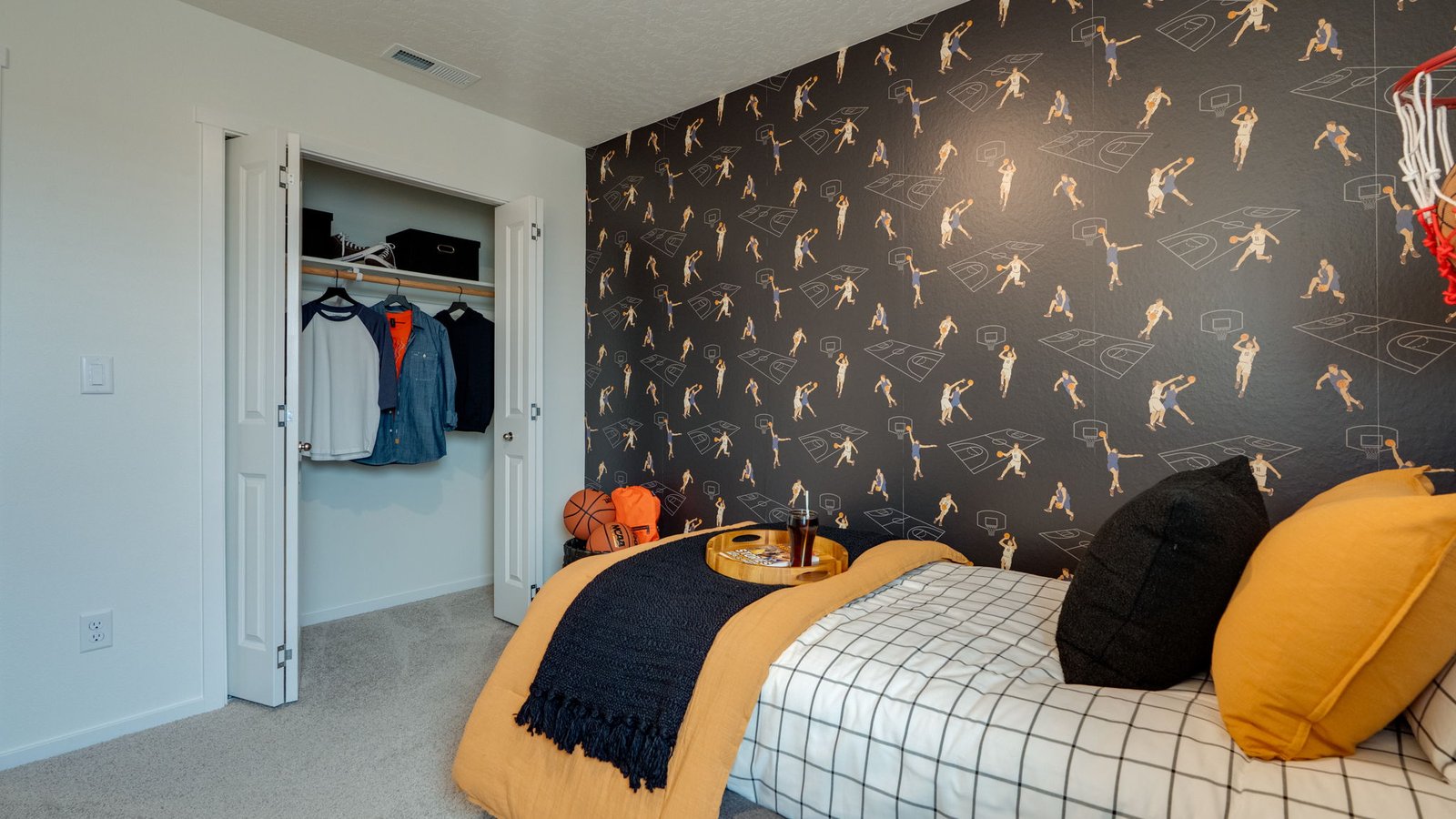 Bedroom with wall-to-wall carpet and a closet
