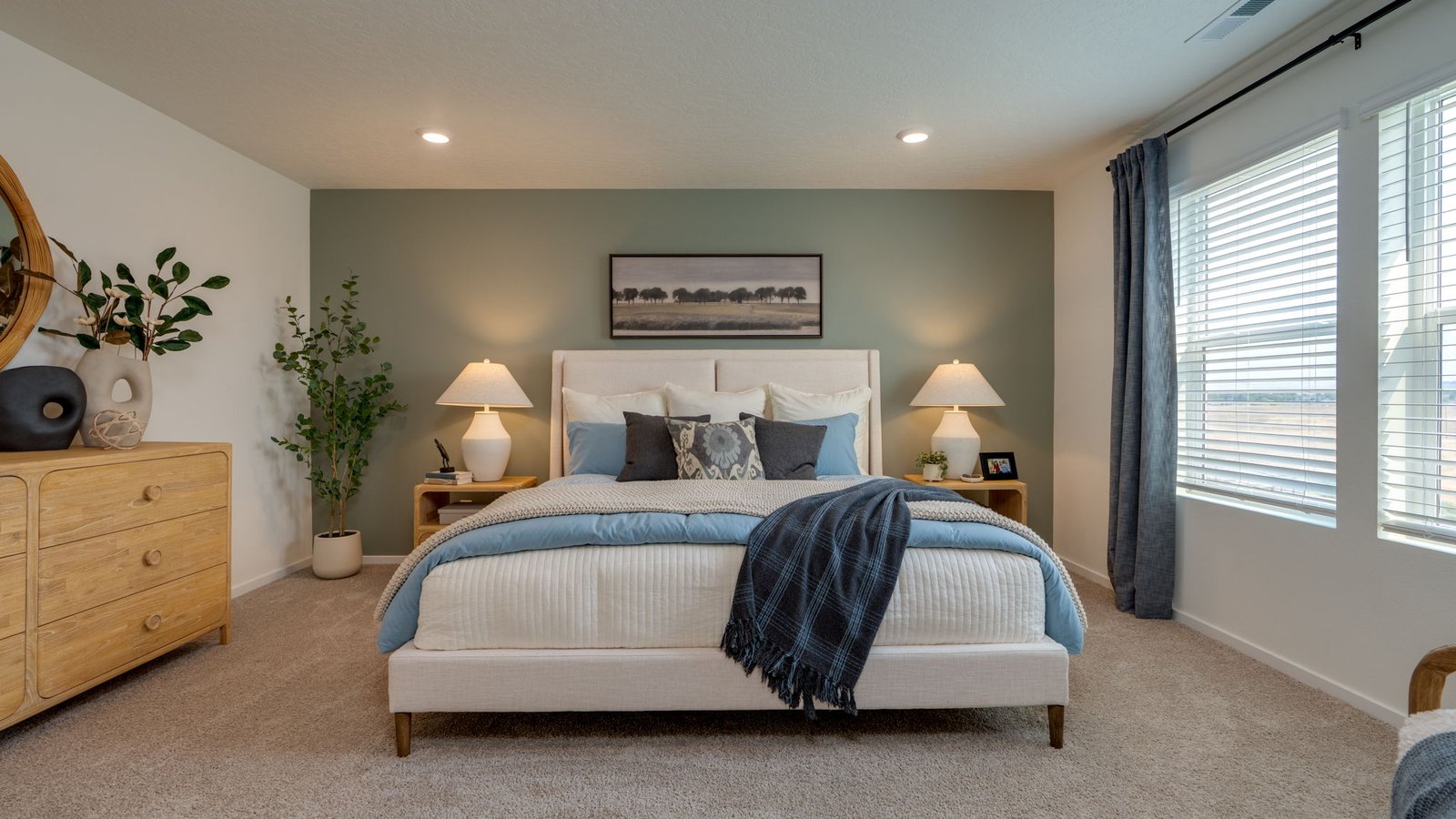 Primary bedroom with wall-to-wall carpet, a walk-in closet and an attached bathroom