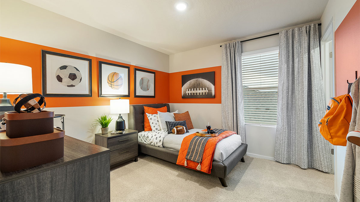 Bedroom with wall-to-wall carpet and a closet