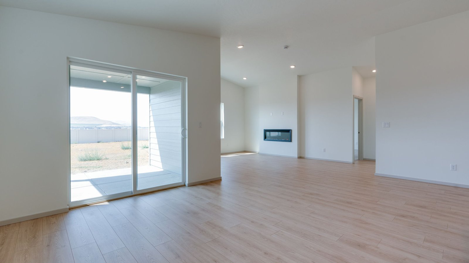 Dining area with a sliding glass door to a fenced backyard