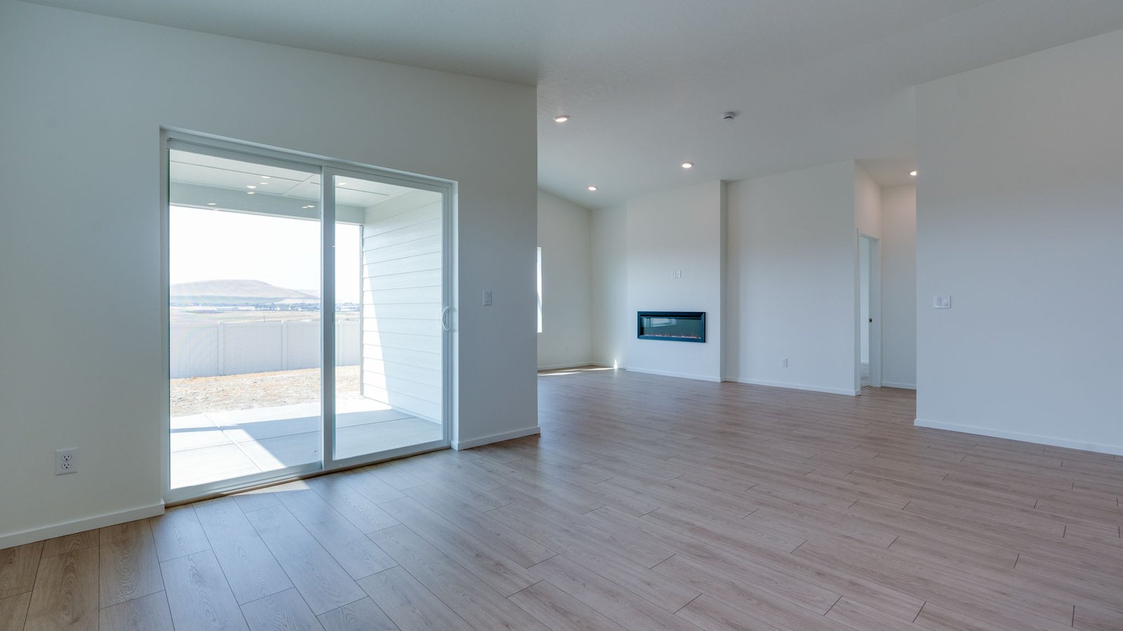Dining area with a sliding glass door to a fenced backyard