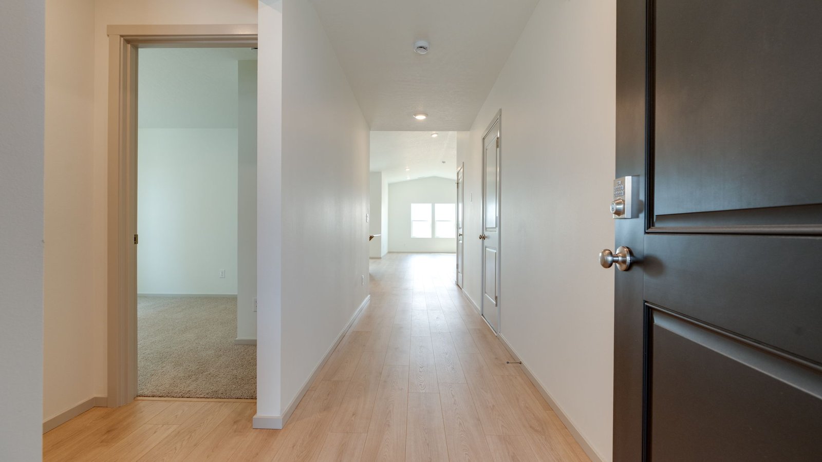 Entryway with a coat closet and laminate flooring