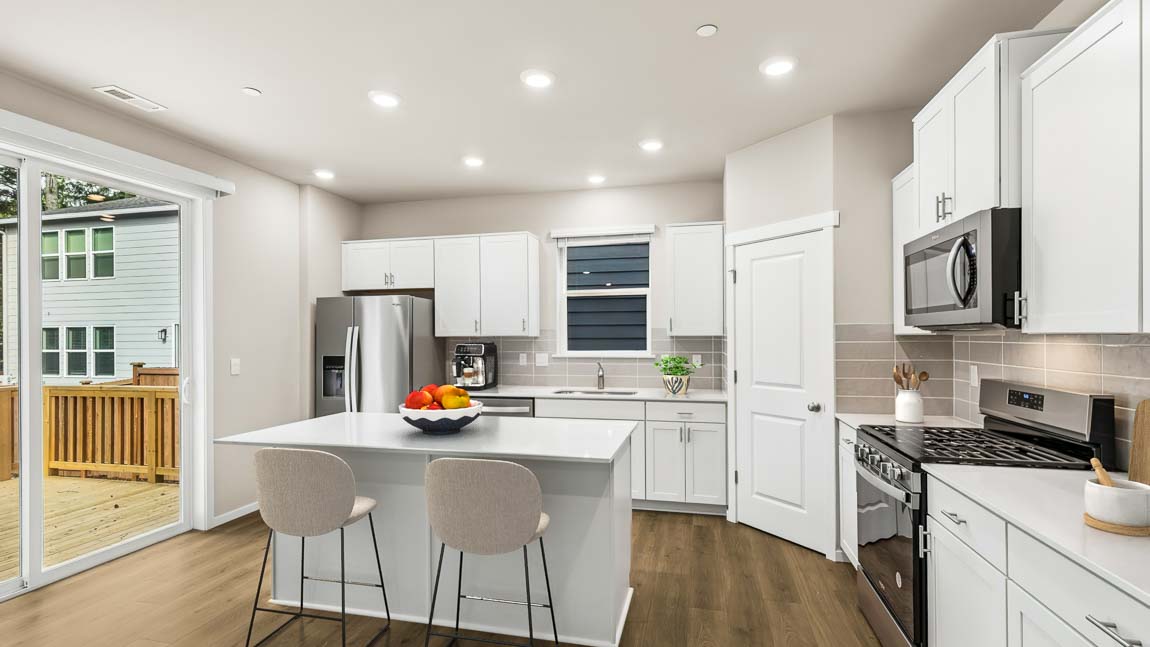 Kitchen with white cabinets and center island