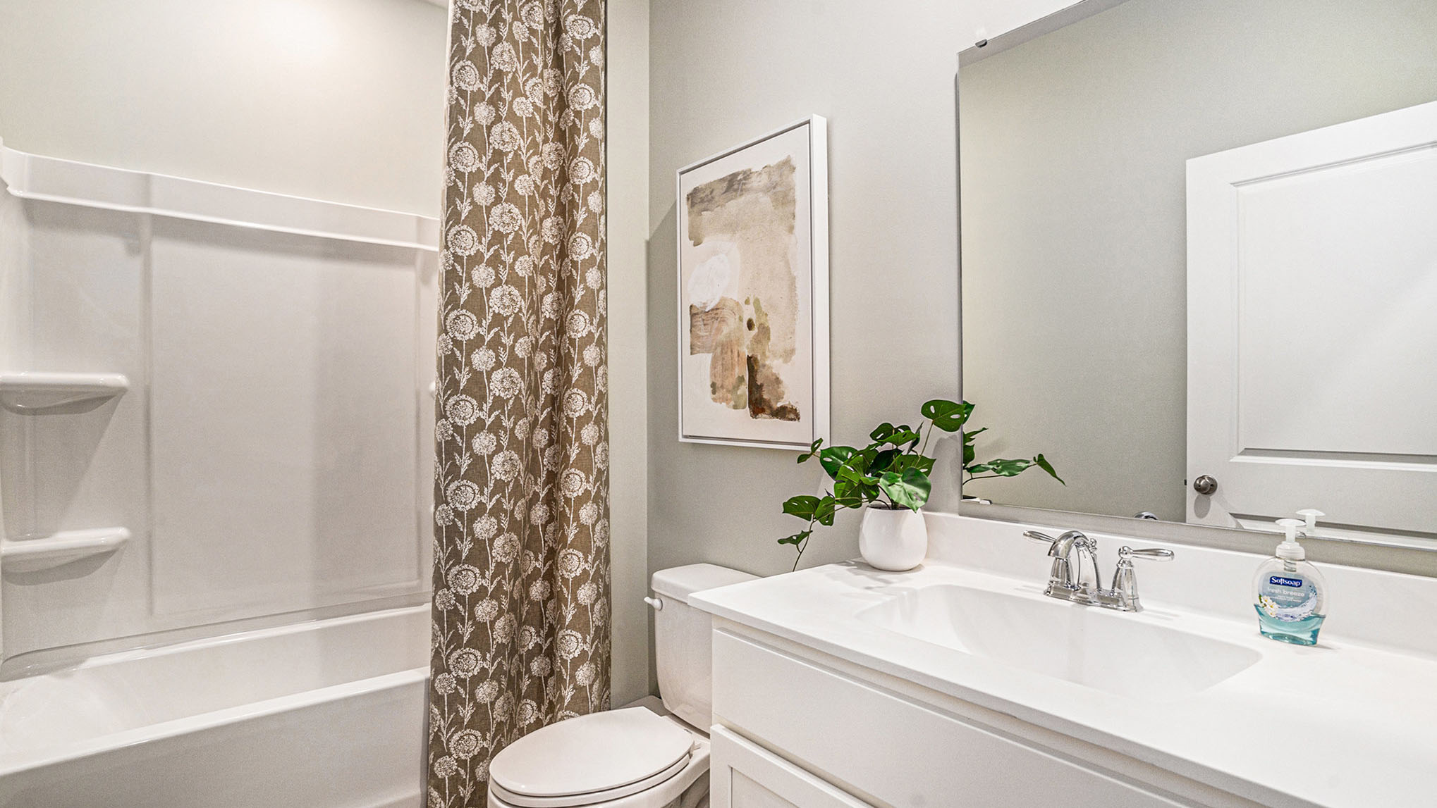 bathroom with quartz counters