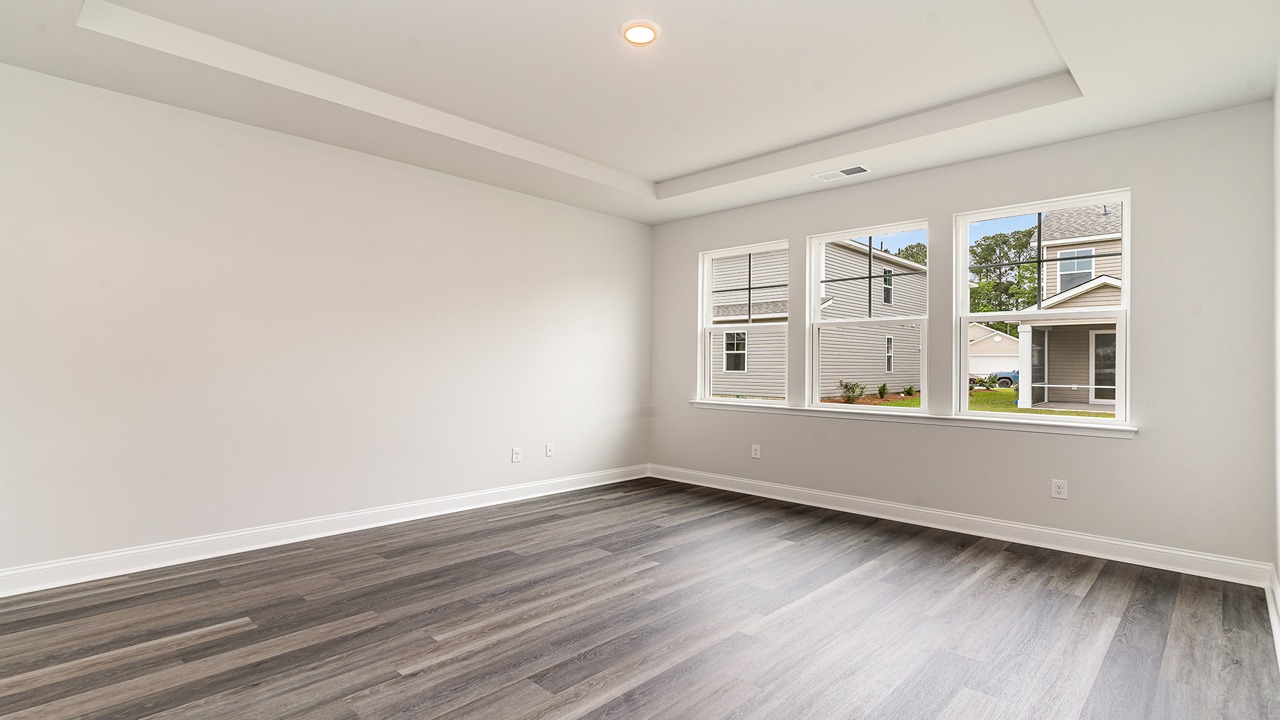 primary bedroom with tray ceilings