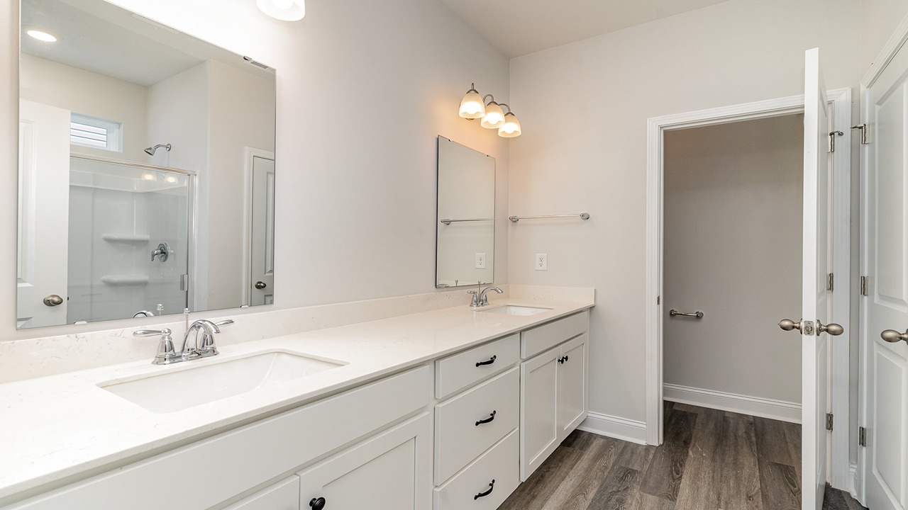 primary bathroom with white cabinets