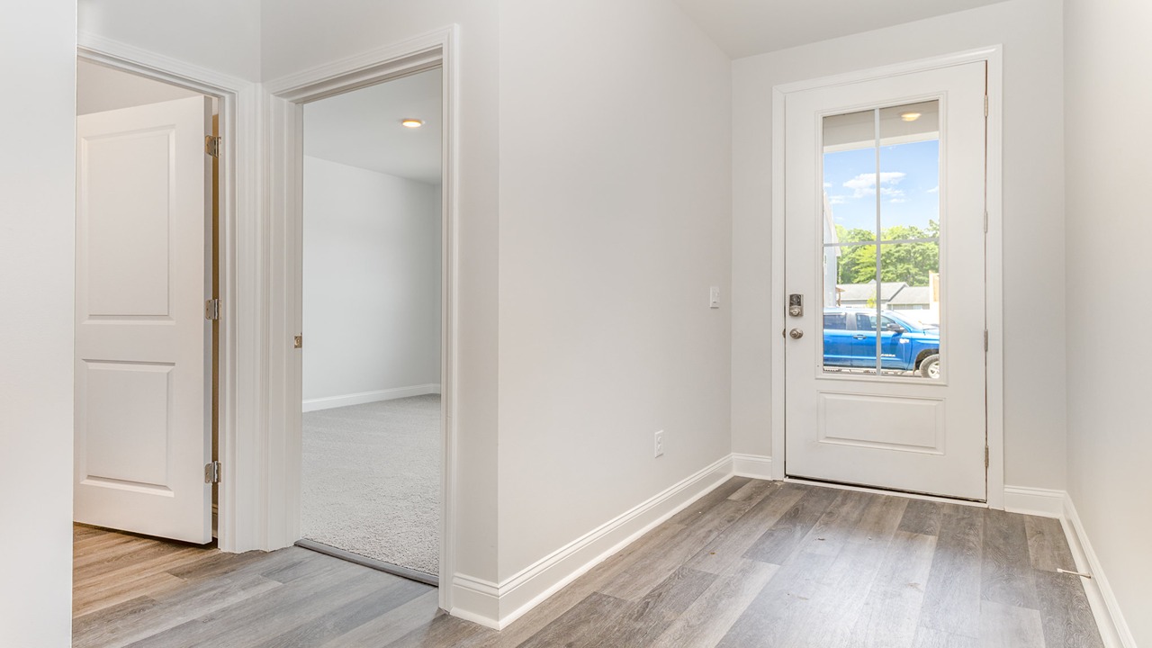 entryway with white door