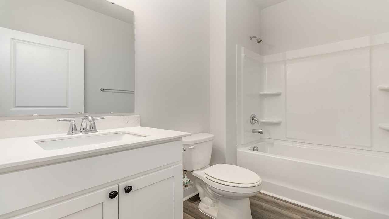 bathroom with quartz counters