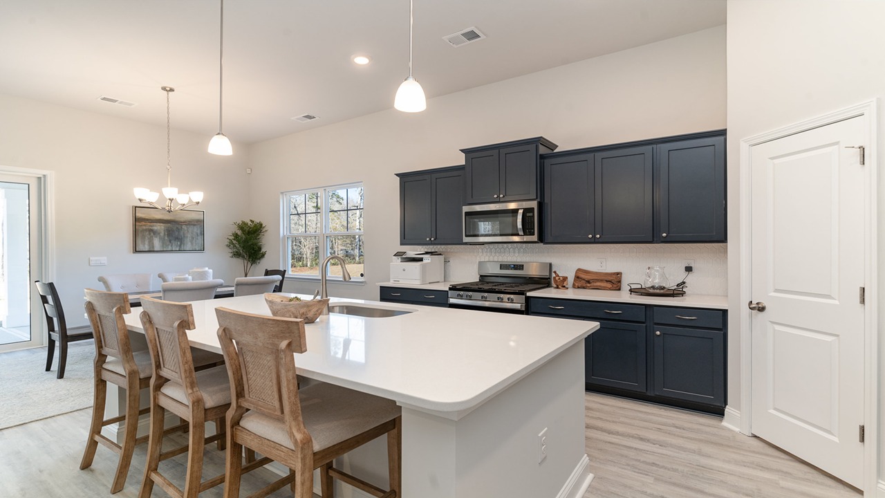 kitchen with navy cabinets and granite countertops