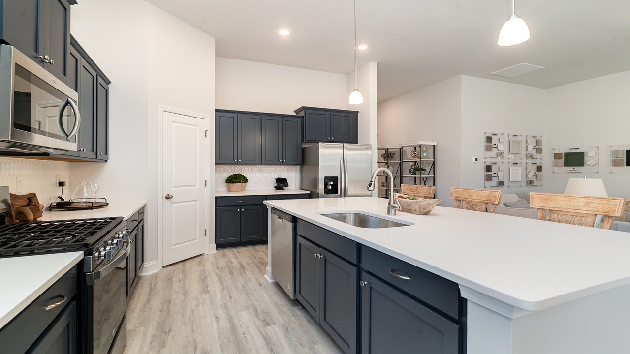 kitchen with navy cabinets and granite countertops