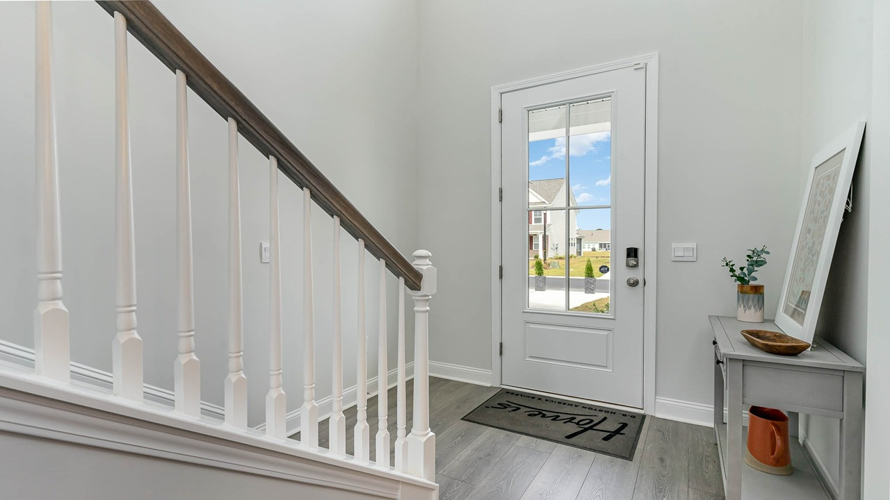 foyer and staircase with vinyl plank flooring