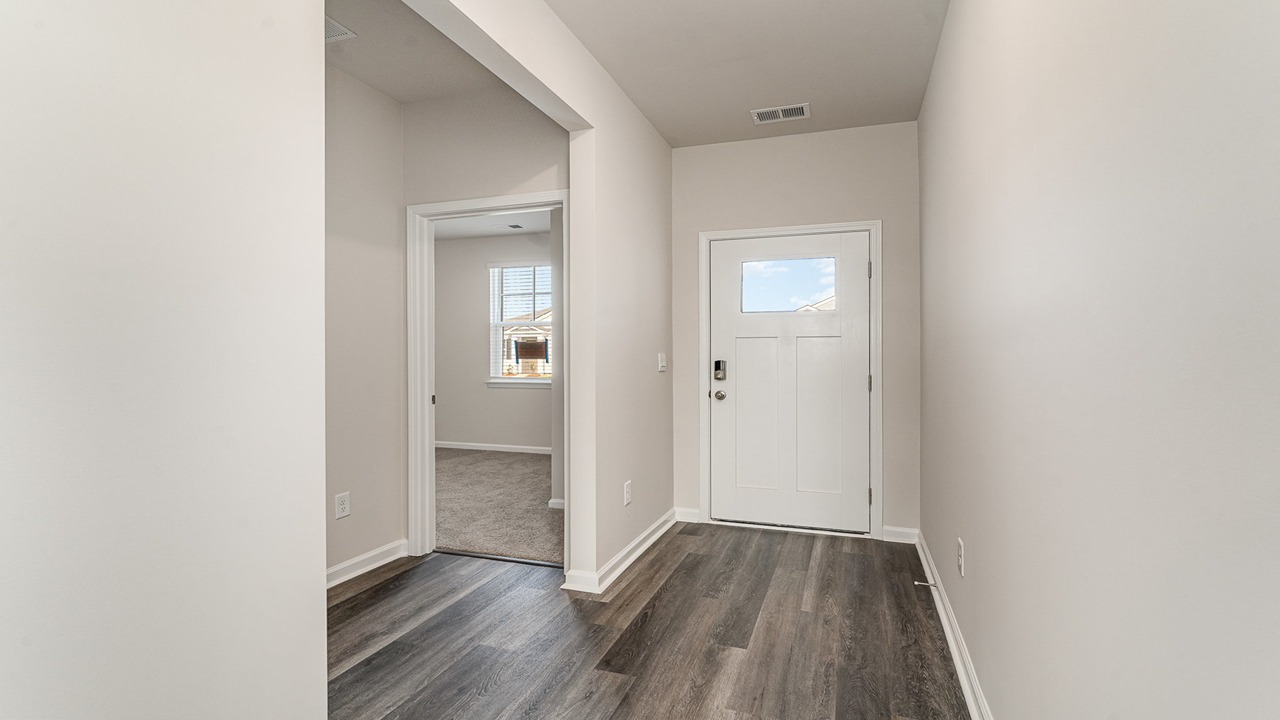entryway with white door