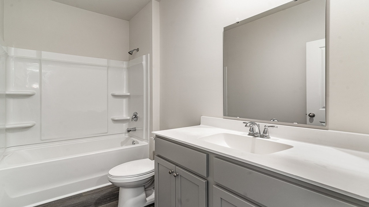 bathroom with quartz counters