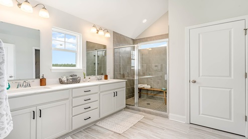 primary bathroom with double white vanity
