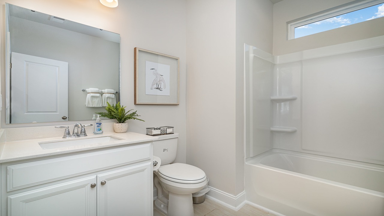 secondary bathroom with shower tub combo