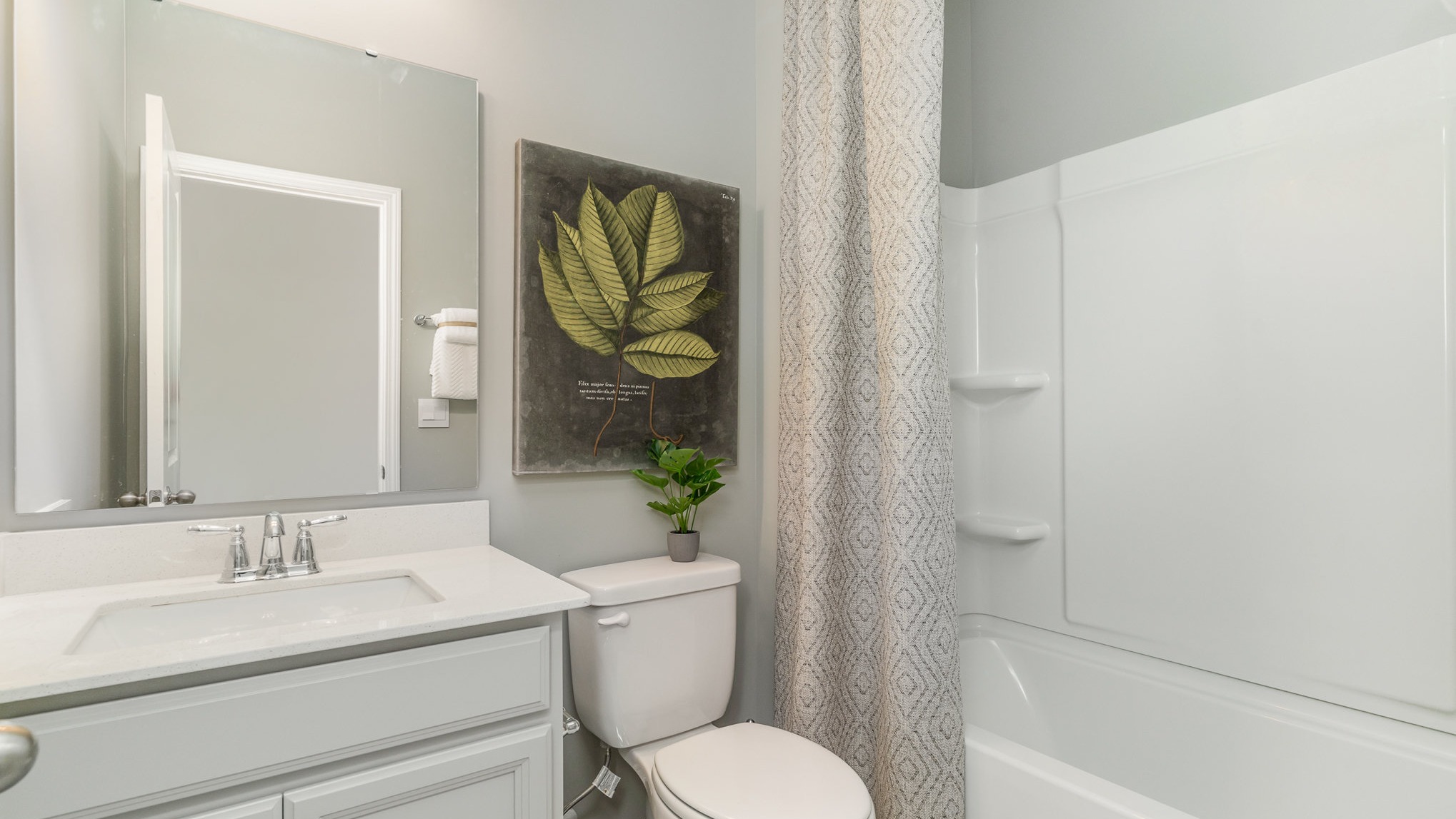 secondary bathroom with shower tub combo