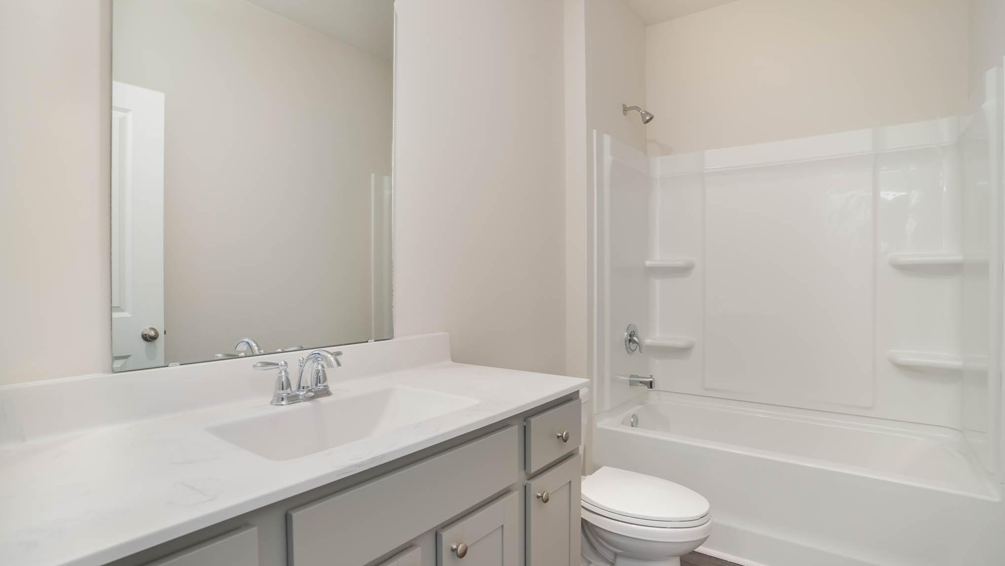 bathroom with quartz counters