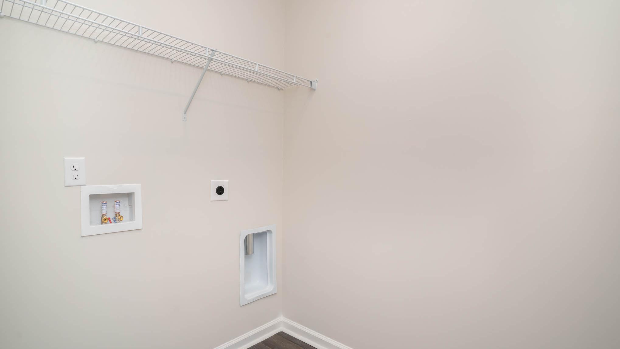 laundry room with wire shelving