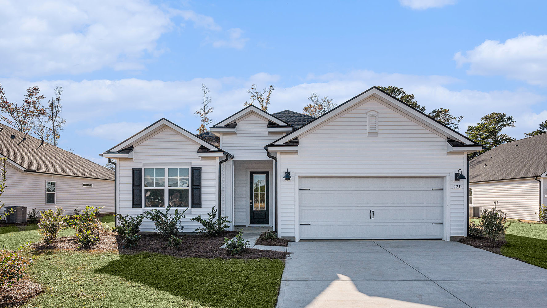 single story home with two car garage