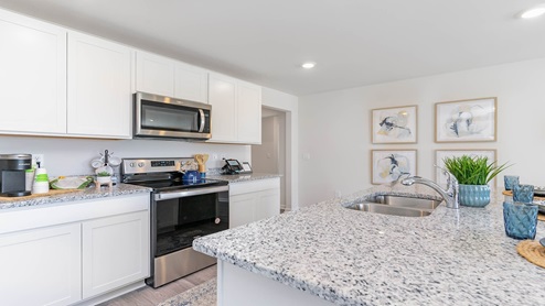 kitchen with white cabinets
