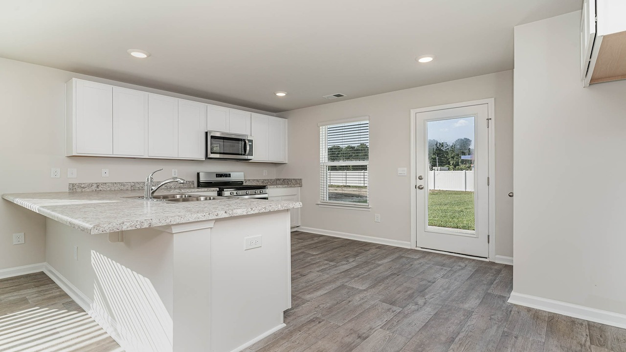 kitchen with white cabinets and granite countertops