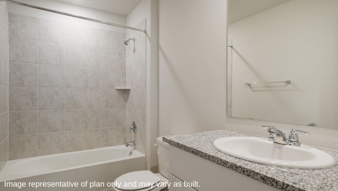 Second full bathroom with combined bathtub and shower, toilet, and single vanity sink.