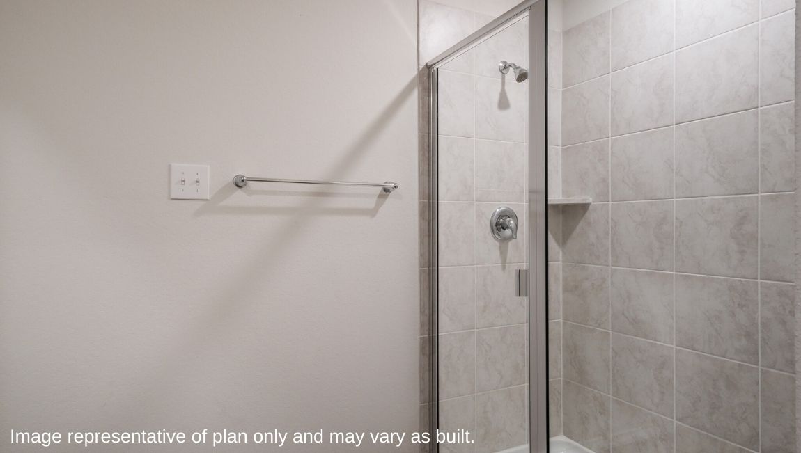 Primary bathroom with walk-in shower and closet.