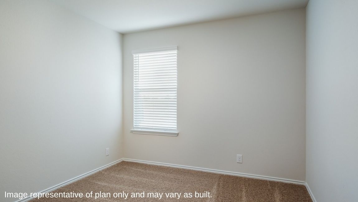Secondary bedroom with quality carpet, closet and windows.