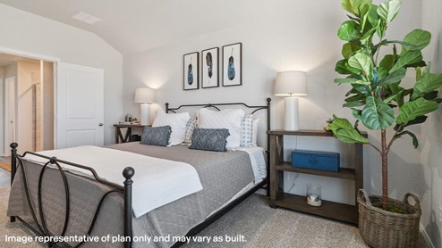 Spacious primary bedroom with quality carpet and ensuite bathroom.