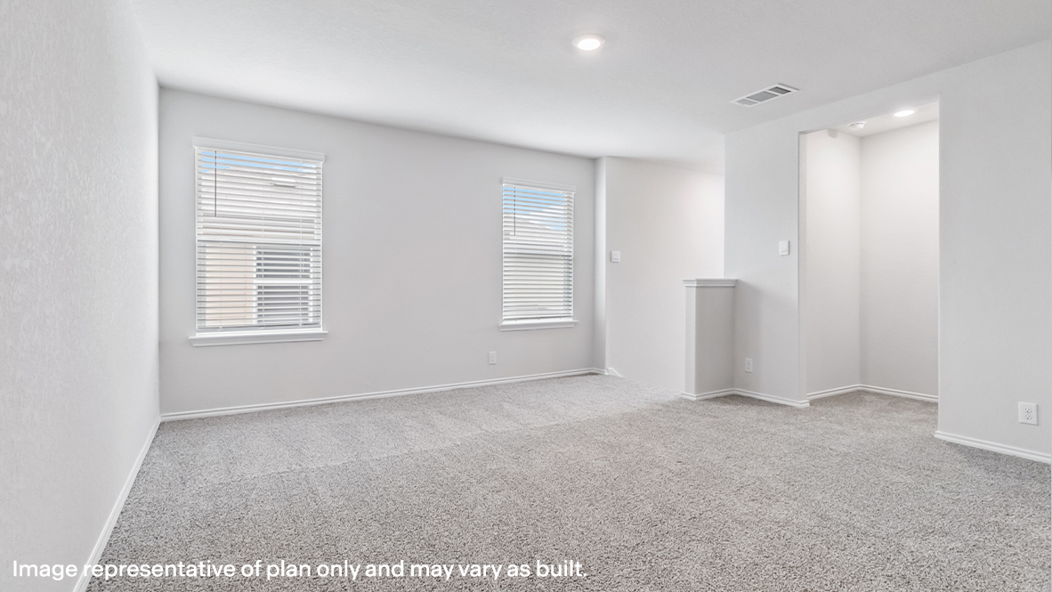 Spacious, open-concept loft with carpet and windows.