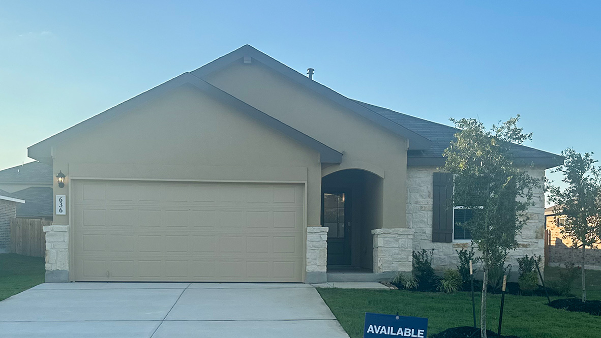 One story home with covered porch, brick and siding front exterior and two car garage.