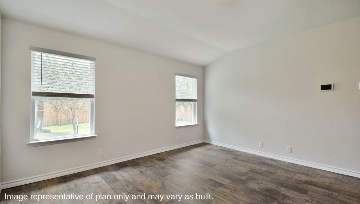 living room with large windows and hard surface flooring
