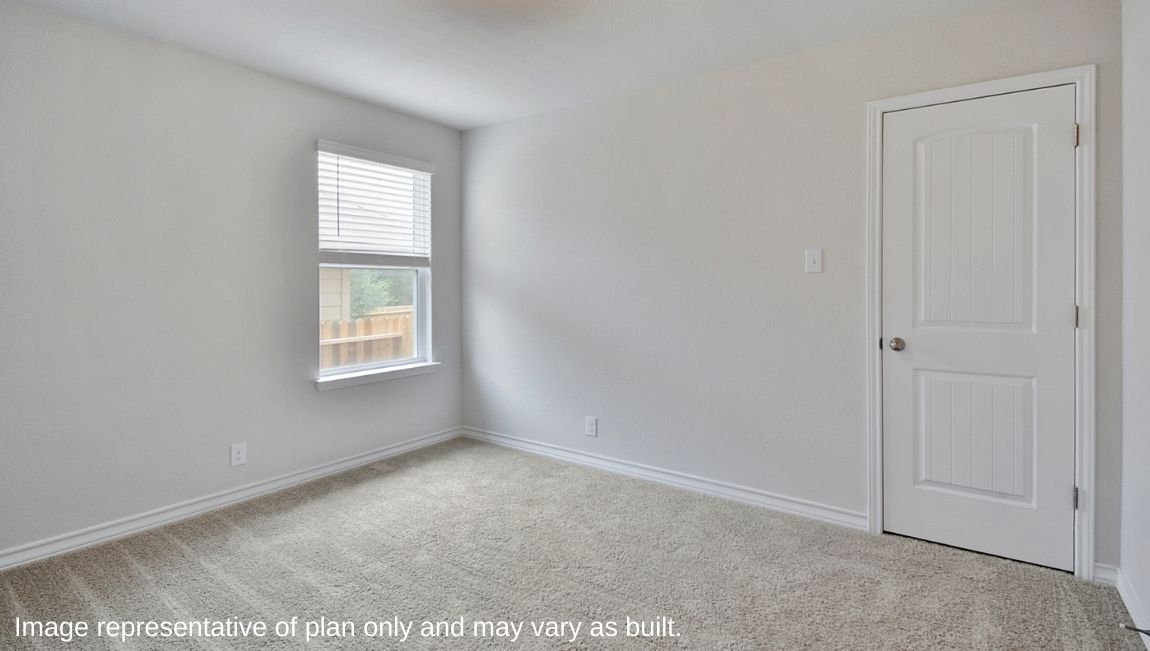 Fourth bedroom with quality carpet, window and closet.