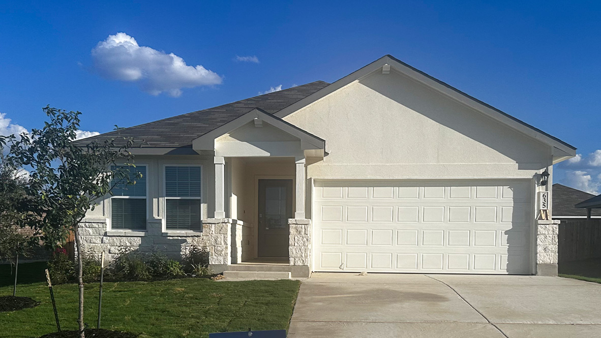 One story home with covered porch, brick front exterior and two car garage.