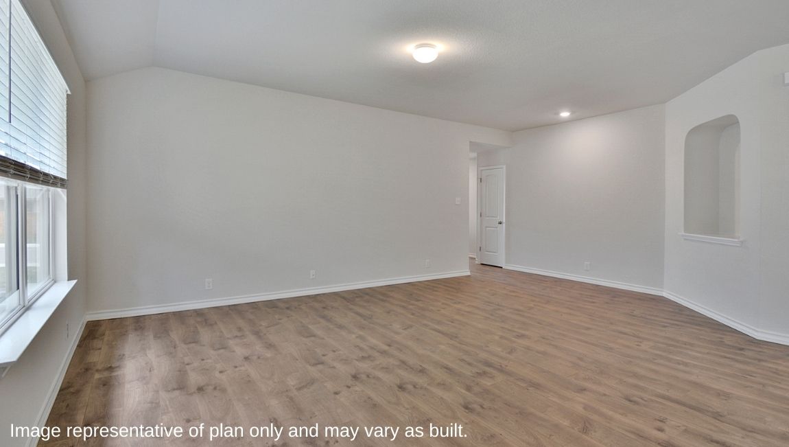 Living room with hard surface flooring and decorative wall nook.