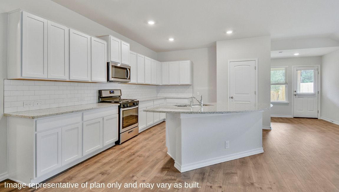 Kitchen with tons of granite or quartz countertop work space, plenty of cabinet storage and spacious kitchen island.