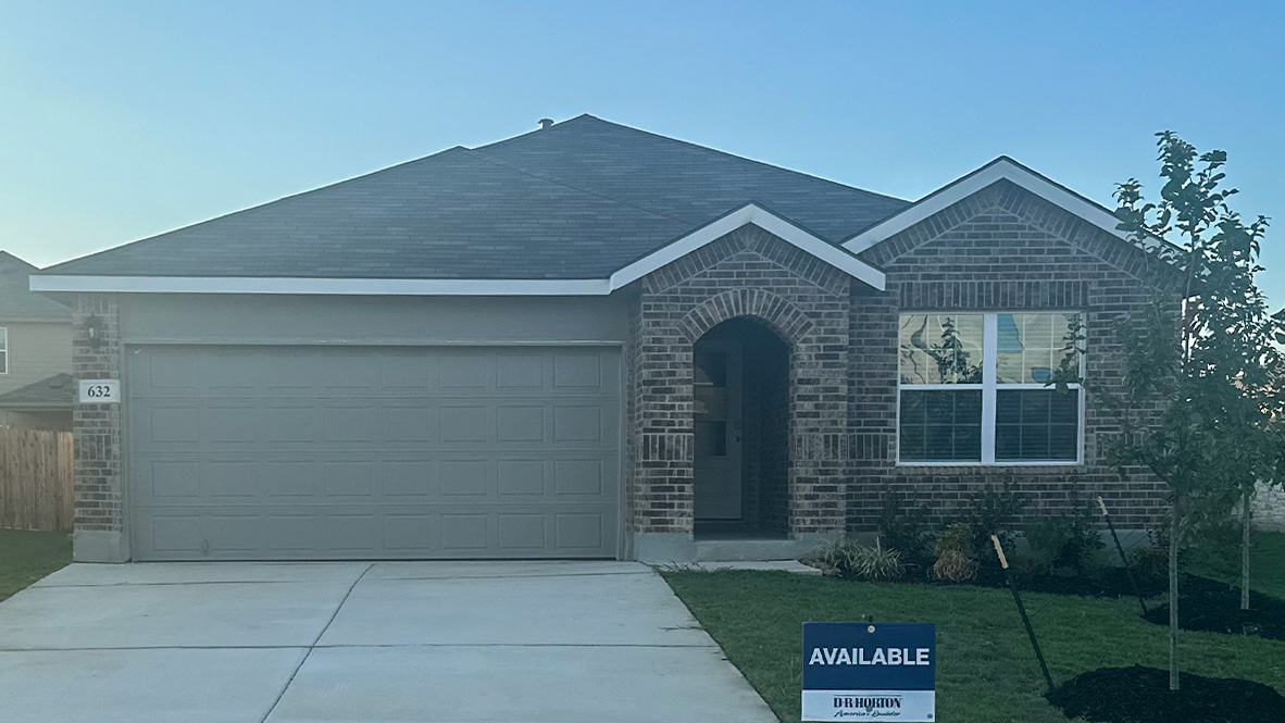 One story home with covered porch, brick front exterior and two car garage.