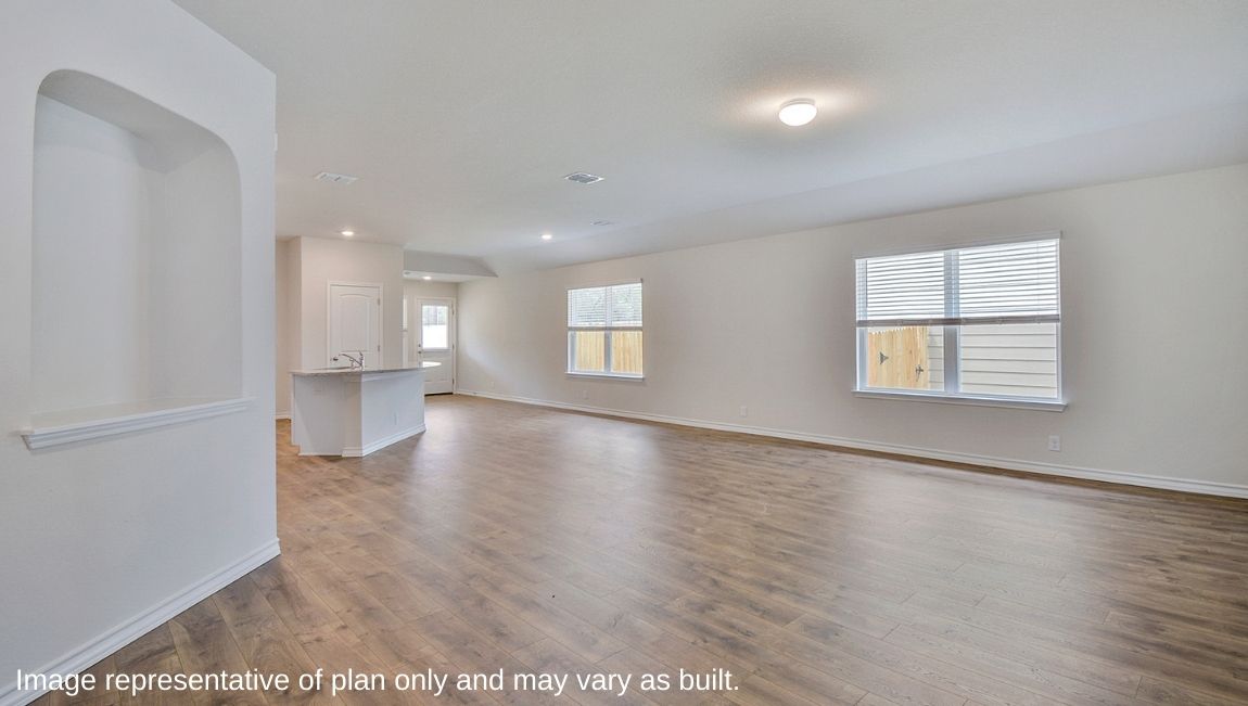 Large decorative wall nook and spacious open-concept family room and kitchen,