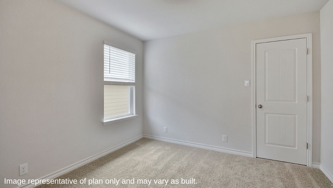 Secondary bedroom with quality carpet, window and closet.