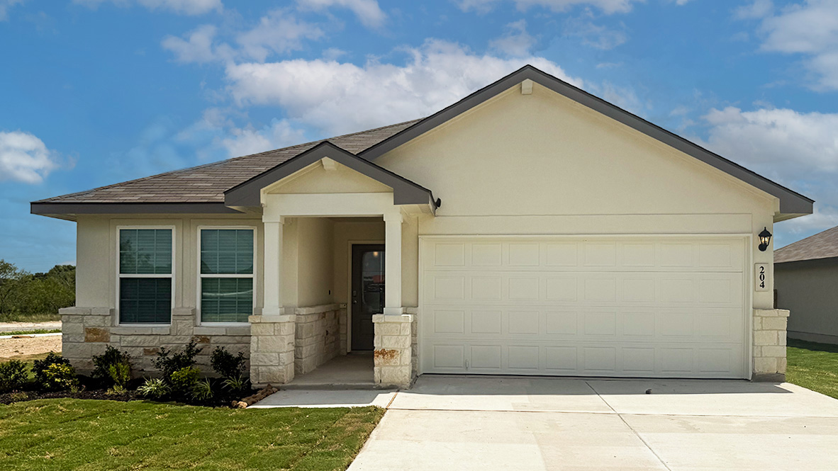 One story home with covered porch, brick front exterior and two car garage.