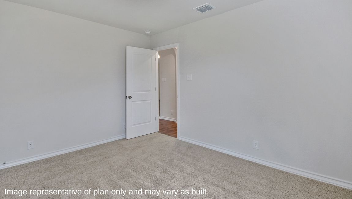 Primary bedroom with quality carpet.