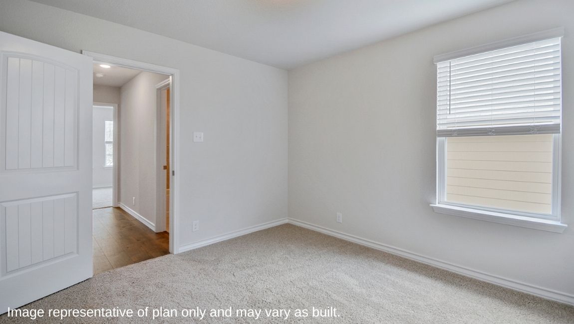 Fourth bedroom with quality carpet, window and closet.