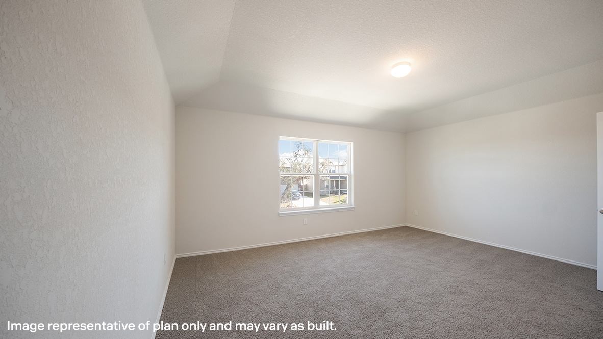 Spacious primary bedroom located off stairway with ensuite bathroom.