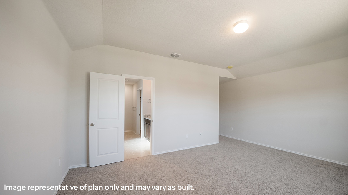 Spacious primary bedroom with quality carpet, semi-vaulted ceilings and windows providing plenty of natural light.