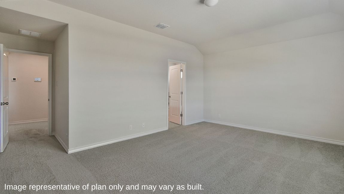 Open-concept kitchen with quartz or quartz countertops, island and stainless steel appliances.