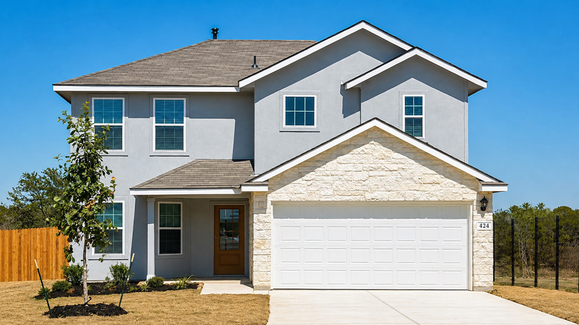 Two story home with covered porch, brick and siding front exterior and two car garage.